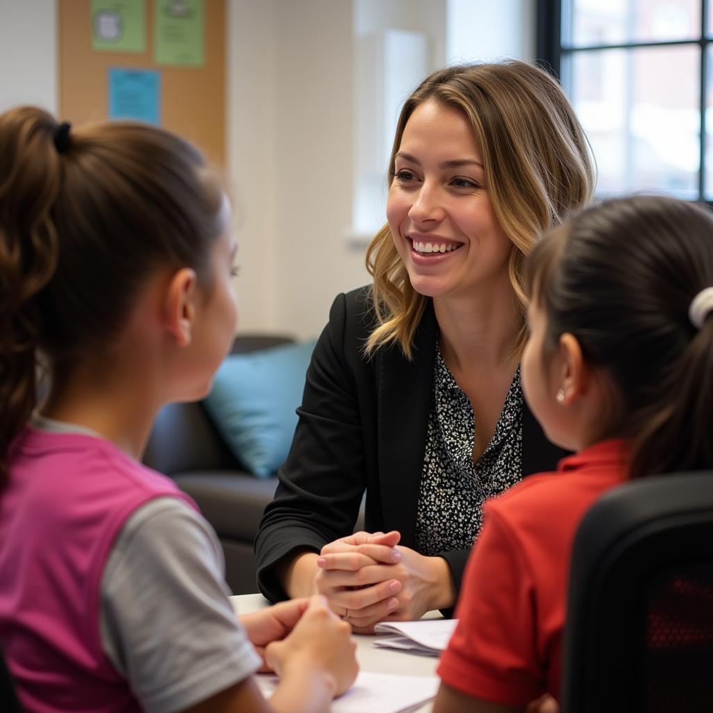Social worker assisting homeless teenagers at youth center