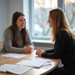 IELTS speaking test examiner interviewing candidate in professional setting