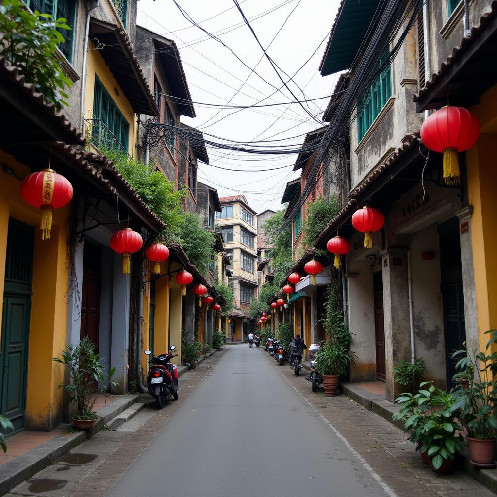 Hanoi Old Quarter's narrow street with traditional tube houses, blending Vietnamese and French colonial architecture.
